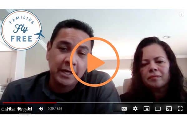 Carlos and Angelica on Families Fly Free video, orange play button