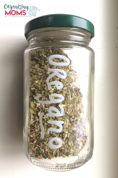 A close up of an oregano spice bottle