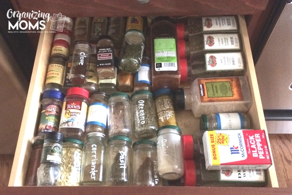 Before picture of messy spice drawer