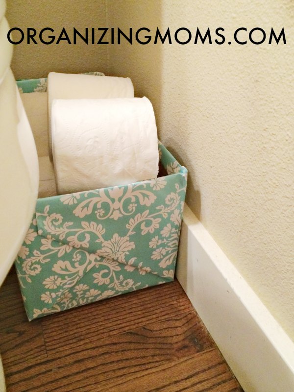 Easy DIY organization project that doesn't cost any money to make! Use stuff you have on hand to make a pretty storage container for toilet paper. Could also be used for storing different types of items.