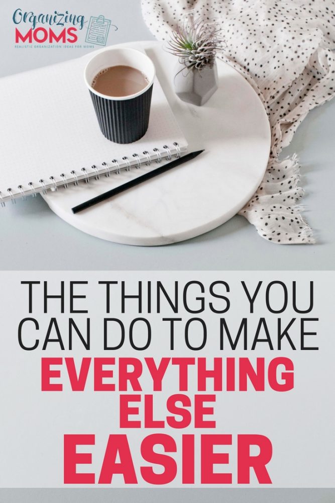 text - the things you can do to make everything else easier. image of notebook, coffee, and plant on marble disc by blanket