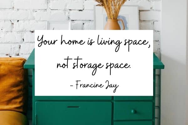 text - your home is living space not storage space. - Francine Jay. Image of green dresser in front of white brick wall