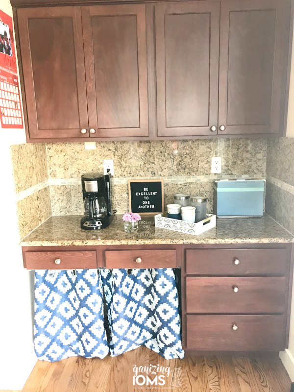 We repurposed our kitchen desk as a coffee and wine bar. Now we have so much more storage space in our kitchen!