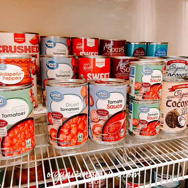 cans on risers in pantry