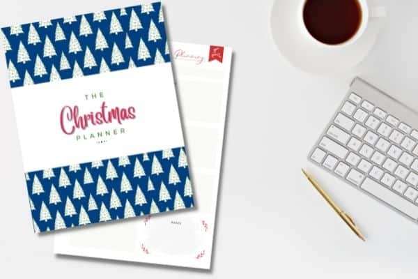 christmas planner printables on white desk with keyboard coffee and gold pen