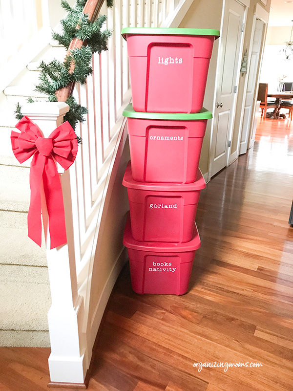 christmas storage tubs by stairs