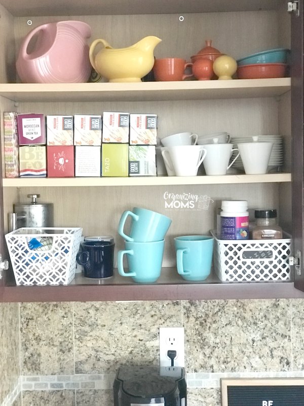 Built in kitchen desk repurposed as a coffee bar. Organized coffee supplies.