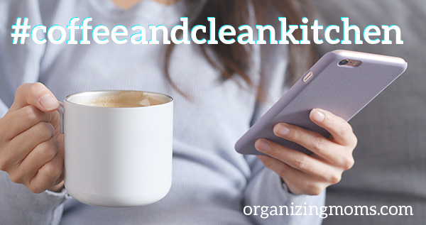 Text #coffeeandcleankitchen organizingmoms . Image of woman holding cell phone and coffee