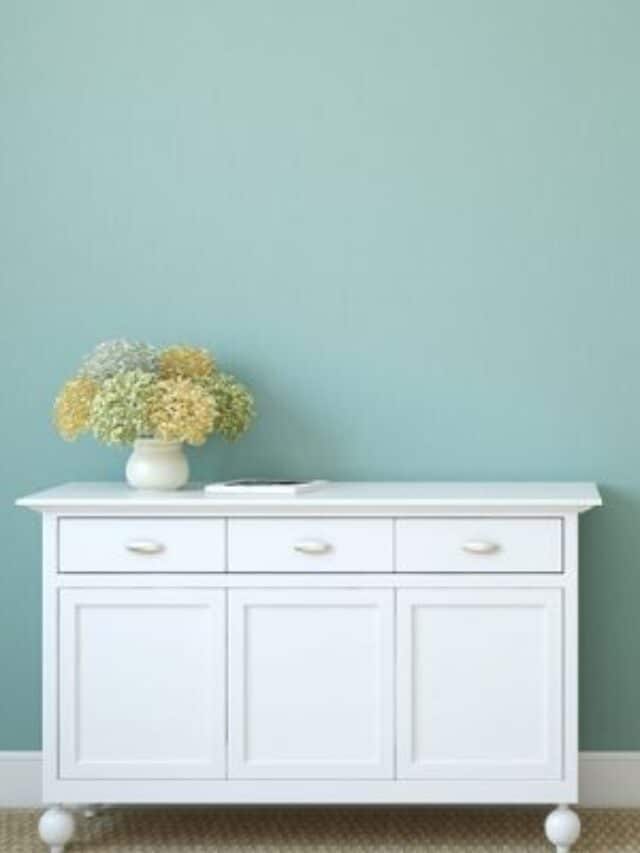 cropped-decluttered-and-organized-white-dresser-and-door-with-blue-wall.jpg