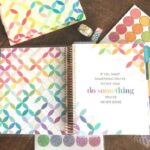 erin condren life planner opened with stickers and tape surrounding