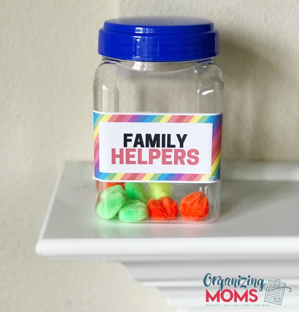 Family helper jar filled with colorful pom poms