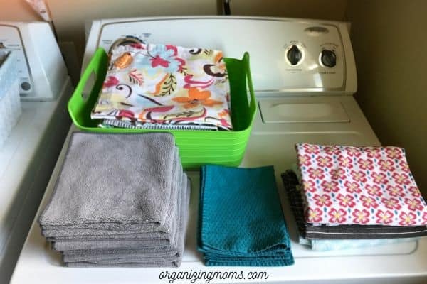 folded linens in laundry room