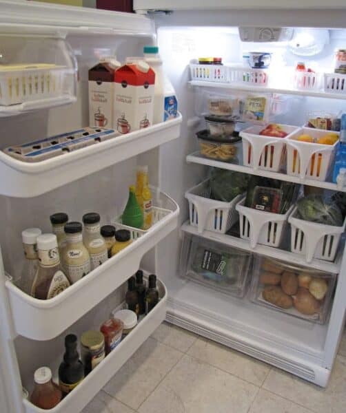An open refrigerator filled with organized food
