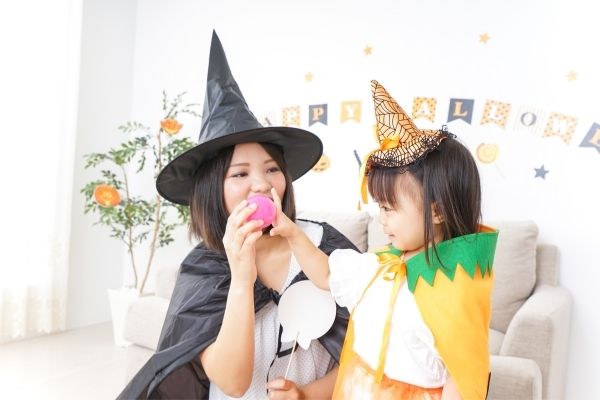 mom and preschooler dressed as witches to symbolize halloween party ideas for preschoolers