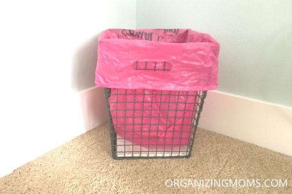 home office garbage basket with pink bag