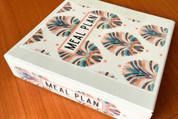 beautiful meal plan binder on wooden table