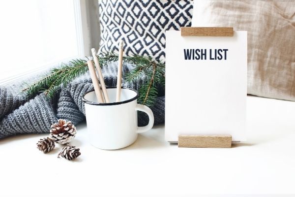 wish list in front of cozy blanket, pillow, mug