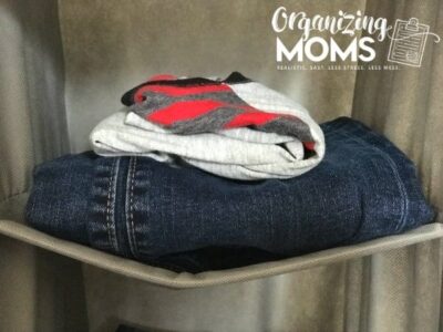 One shirt and one pair of jeans in each cubby. How to help your child organize clothes.