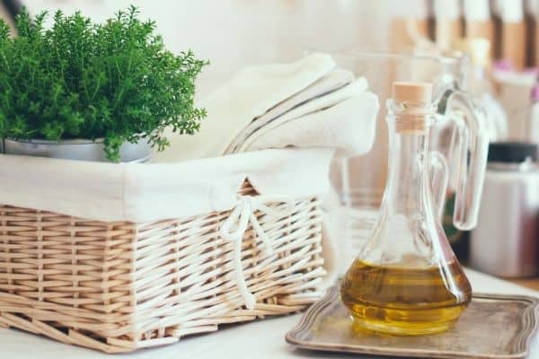 kitchen basket and olive oil on tray