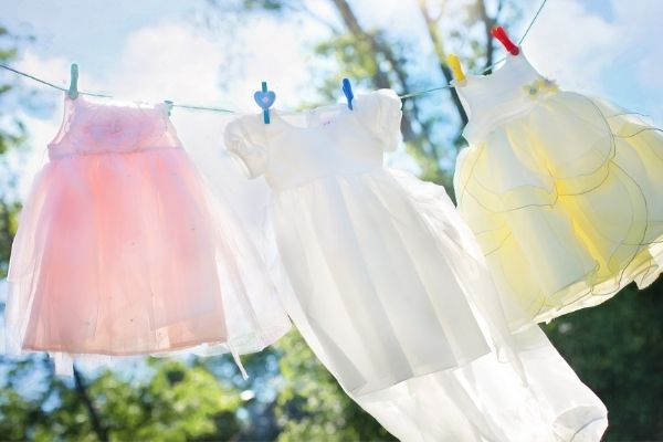 girls dresses drying on clothesline to symbolize laundry routine