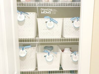 Use baskets and storage bins to organize your linen closet and eliminate visual clutter.