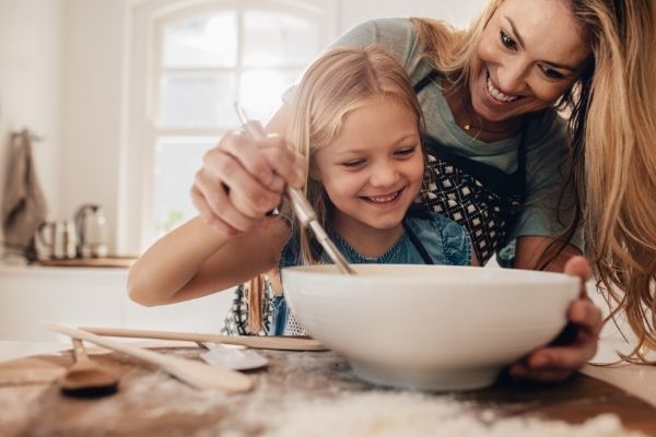 mother and daughter cooking