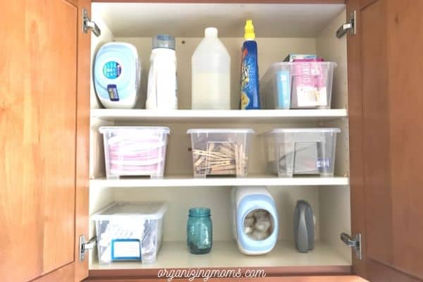 organized laundry room storage cabinet