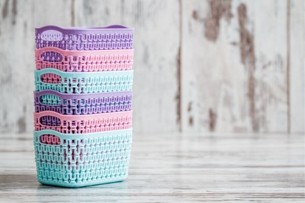 multicolored baskets on table to represent organizing with baskets