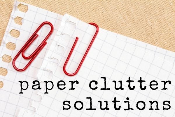 text paper clutter solutions graph paper with red paperclips