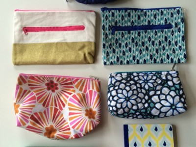 A group of pouches for a purse on a table