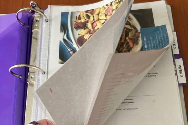 recipes in plastic page protectors inside meal plan binder