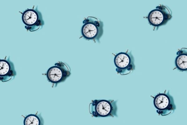 blue clocks on aqua background to symbolize shorter timeframe