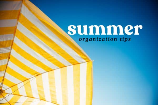 summer organization tips. blue sky and striped umbrella