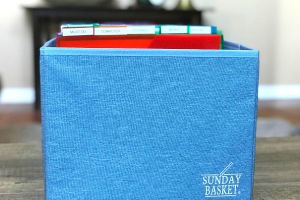 Blue Sunday Basket on wooden table.