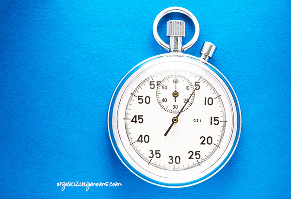 A stopwatch used as a timer on white background.