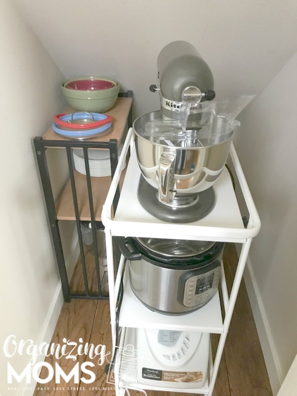 IKEA cart and shelf used for storage in under stairs closet. This is a closet shelving idea for under the stairs that is renter friendly and easy to set up.