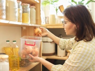 woman doing pantry inventory counting onions