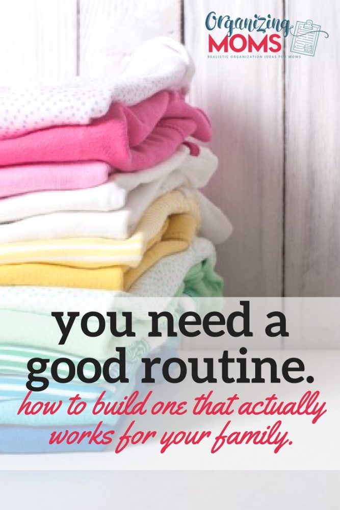 Text: You need a good routine. How to build one that actually works for you. Pile of folded laundry on white table with wooden wall in background